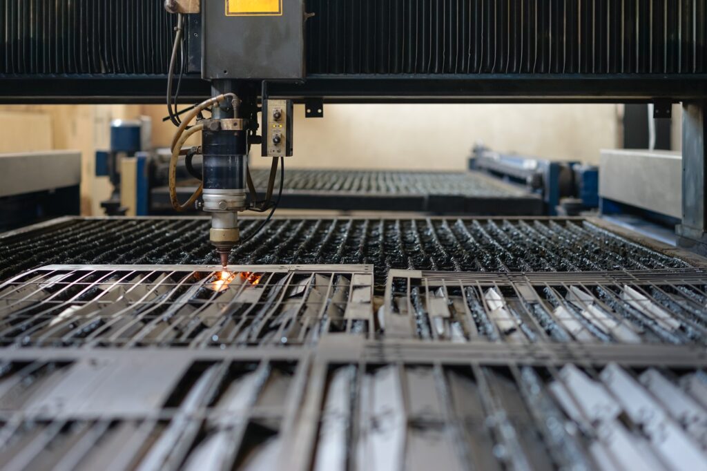 laser head cutting metal sheets into plates